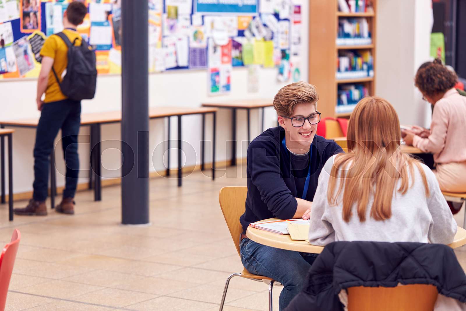 Communal Area Of Busy College Campus With Students Stock Photo Image