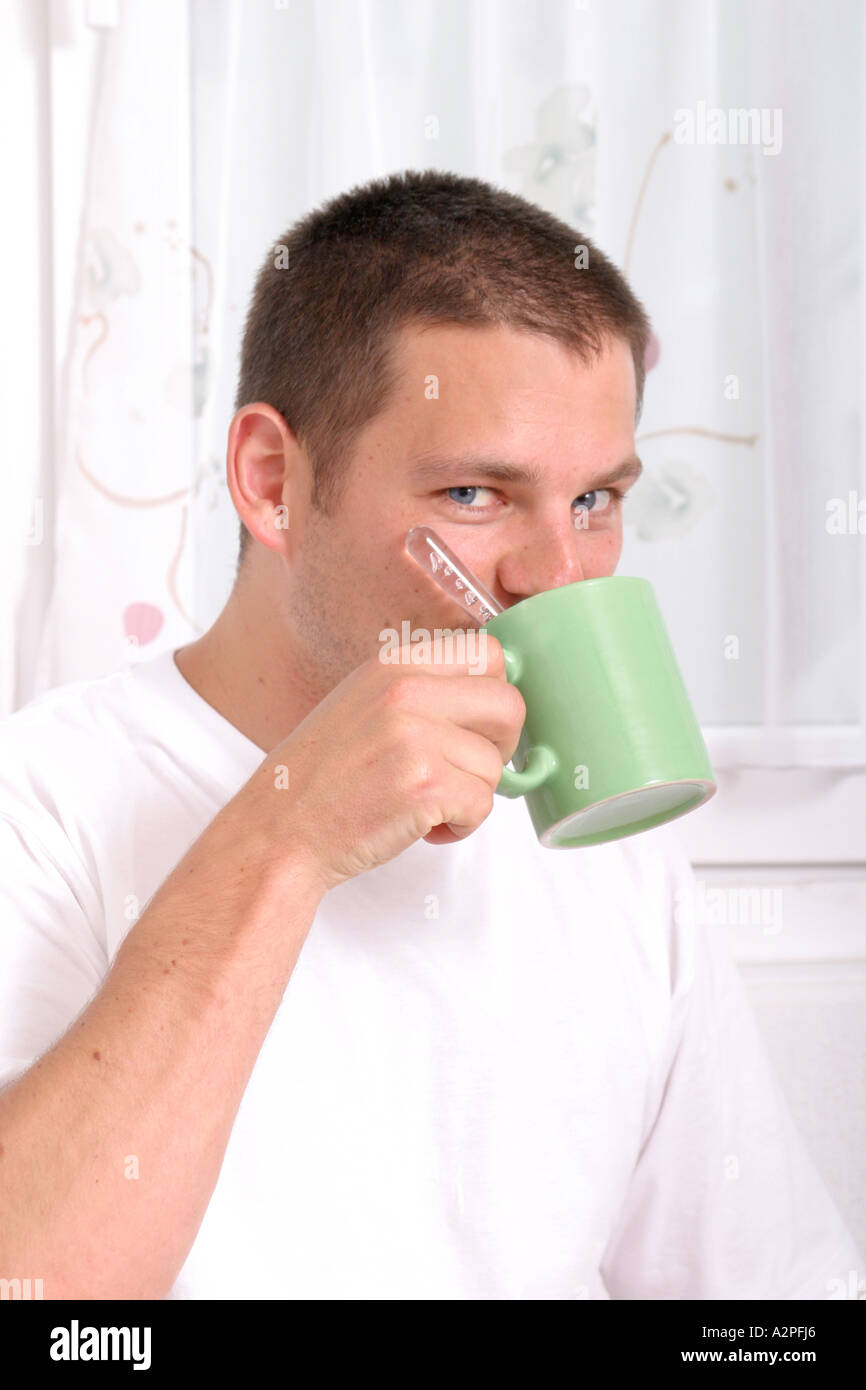 Man Drinking Out Of A Cup Stock Photo Image Of Pondering 75441140