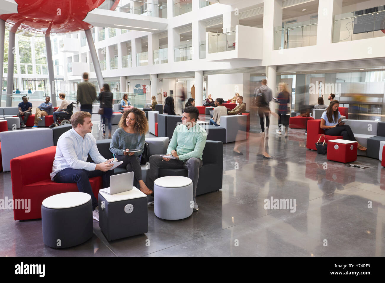 Students Talking In Busy University Campus Building Stock Image Image